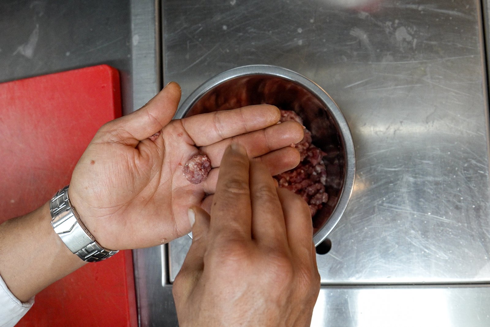 Preparing lamb and sausage meatballs
