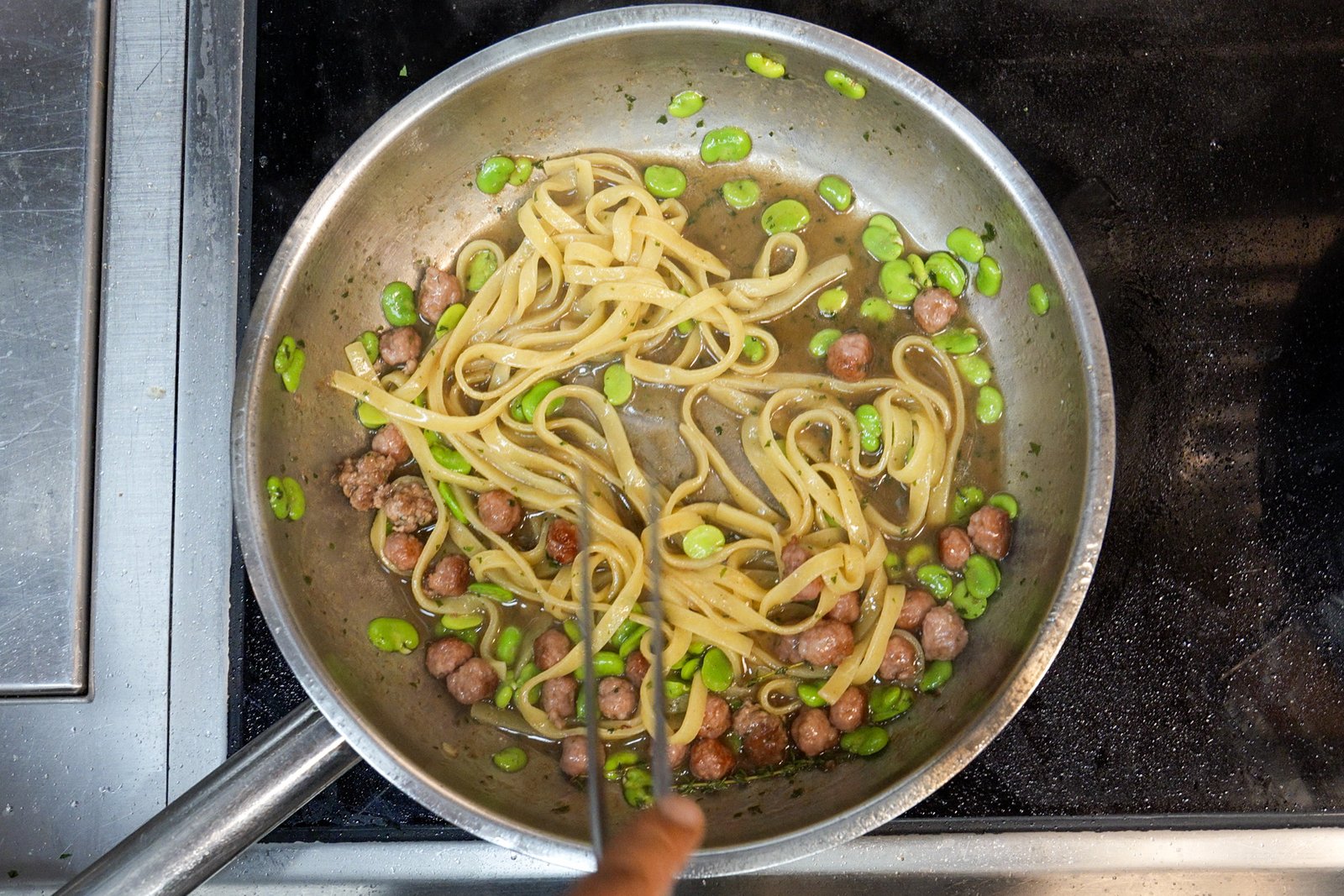 Finishing fettuccine with meatballs