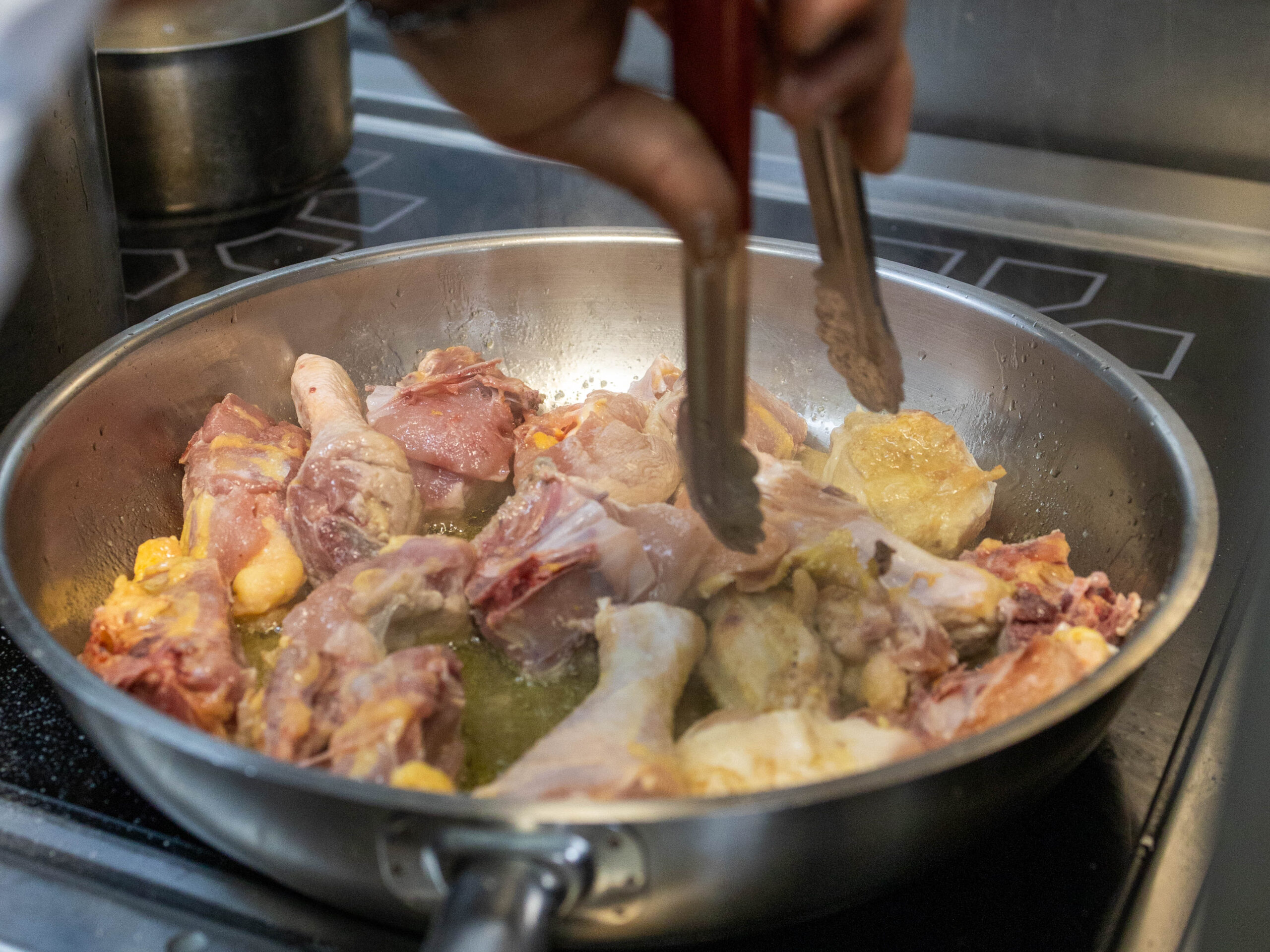 Flouring and searing the chicken